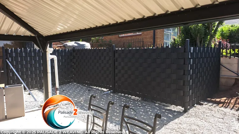 28m Black Palisade installation and weaving, Installation enclosure for water tanks in Ruimsig